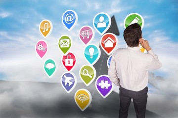 Composite image of thinking businessman touching his chin