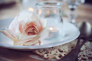 vintage table setting with beige rose