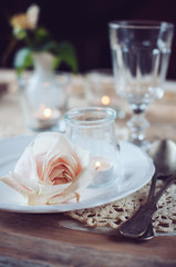 vintage table setting with beige rose
