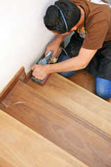 Carpenter working on a wooden stairway