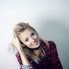 Fototapeta premium Smiling cheerful blonde gitl.