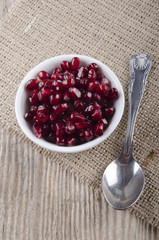 pomegranate seed in a white bowl