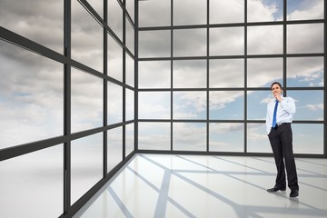 Composite image of thinking businessman touching chin