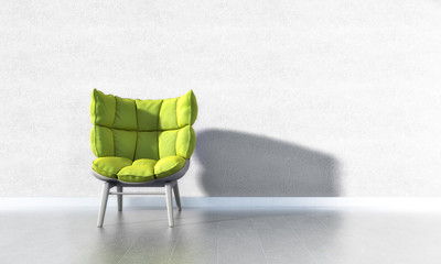 Grüner Sessel vor weißer Wand