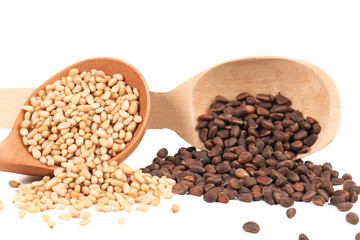 Wooden spoons with pine nuts.