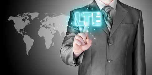 businessman is pushing his finger on lte button