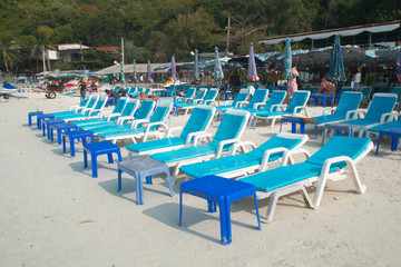beach chairs with white umbrella
