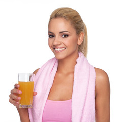 Attractive blonde with orange juice and towel around the neck