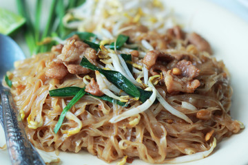 Stir fried rice noodle on plate.