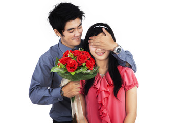 A man giving flowers to woman