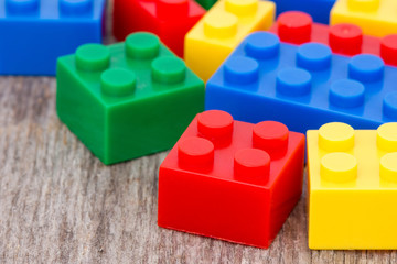 Plastic  blocks on the wooden background