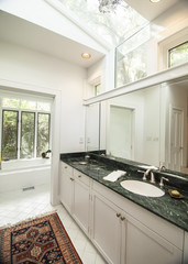 simple modern bathroom with black granite counter