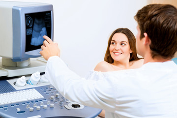 pregnant woman on reception at the doctor