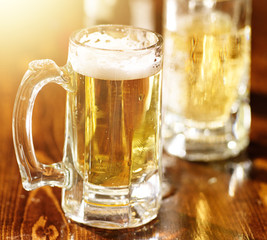 large mug of beer on wood counter