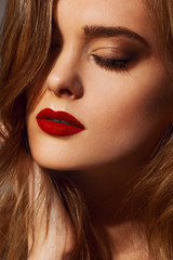 Beautiful young model with red lips