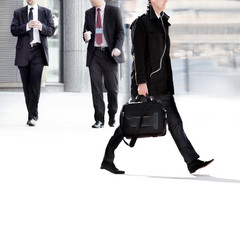 People walking against a light background.