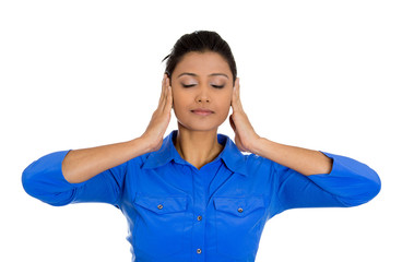 Woman covering her ears with hands, eyes closed, hear no evil