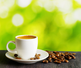 Cup of coffee on nature background