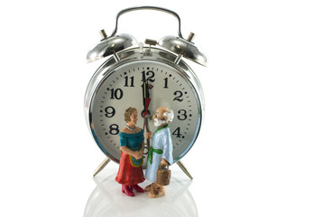 older couple waiting at the clock