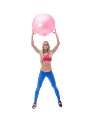 Pretty long-haired sporty model posing with ball