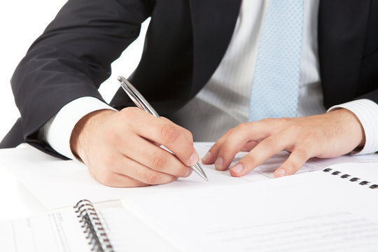 Businessman  hands pointing at business document
