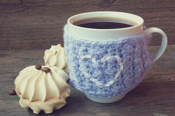 mug of coffee and vanilla zephyr for snack