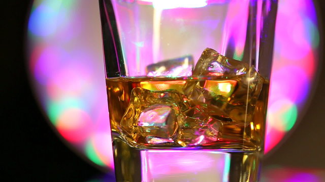 Brandy with ice cubes turns around