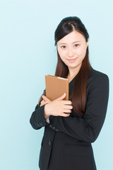 young asian businesswoman on blue background