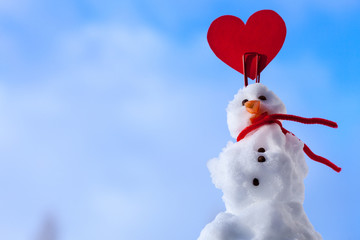 Little valentine snowman red heart love symbol outdoor. Winter.
