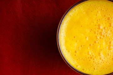 Diet nutrition. Closeup of fresh yellow fruit juice in glass