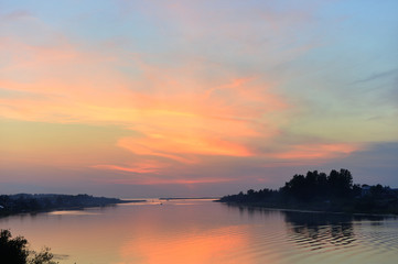 Naklejka na ściany i meble Sunset on a lake.