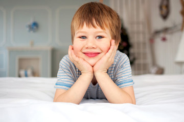 Little boy lying on the bed