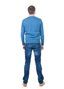Back view of handsome man in blue pullover.