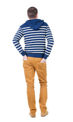 Fototapeta premium Back view of handsome man in striped hooded sweater.