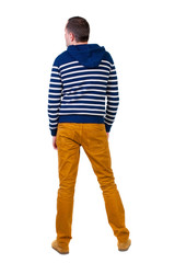 Naklejka premium Back view of handsome man in striped hooded sweater.