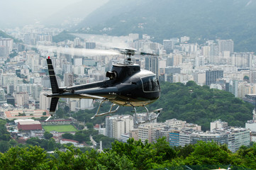 Excursion helicopter taking off and Botafogo in Rio de Janeiro