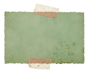 old green paper sheet with tape isolated on white