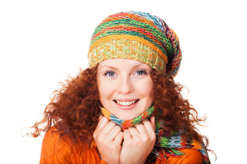 Smiling redhead girl in warm clothing