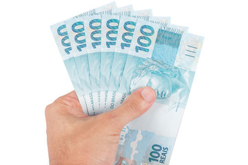 male hand holding brazilian six hundred reais, brazil money