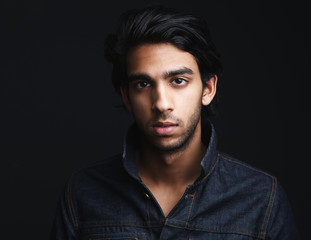 Portrait of a young man with denim jeans jacket