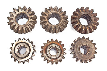 Old metal cogs isolated on white