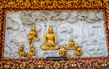 Fototapeta premium Ancient golden carving wooden window of Thai temple. Thailand