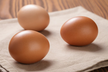 brown eggs  on napkin over table