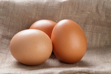 brown eggs  on burlap or sack cloth