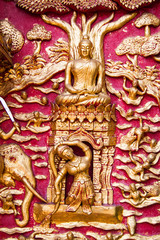 Ancient golden carving wooden window of Thai temple. Thailand