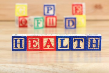 Health - wooden toy block letter concept