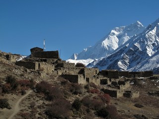 Fototapeta premium Old ruined village and Annapurna Two, Nepal