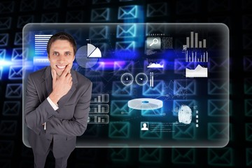 Composite image of thinking businessman touching his chin