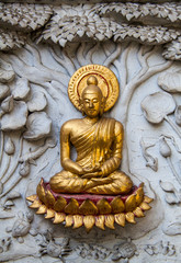 Fototapeta premium Ancient golden carving wooden window of Thai temple. Thailand