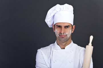 Male chef portrait against grey background